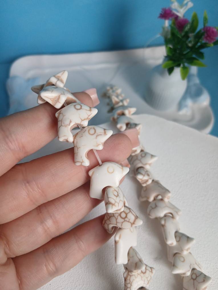مهره دلفین  رنگ کرم ریسه ای